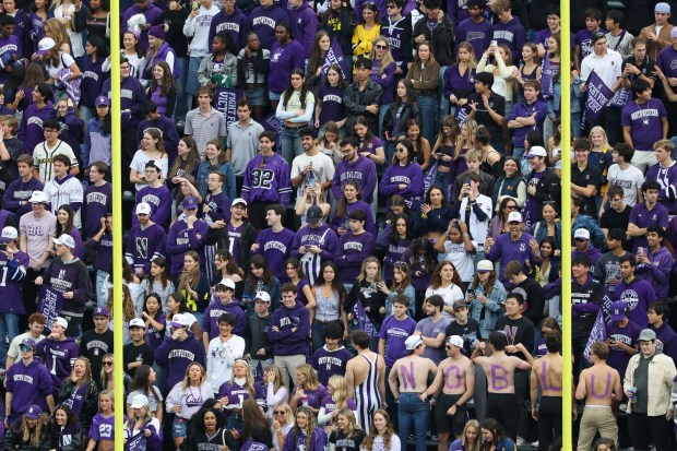 Northwestern student fans wait for the start of the game against Michigan at Wrigley Field on Nov. 15, 2025, in Chicago. (John J. Kim/Chicago Tribune)