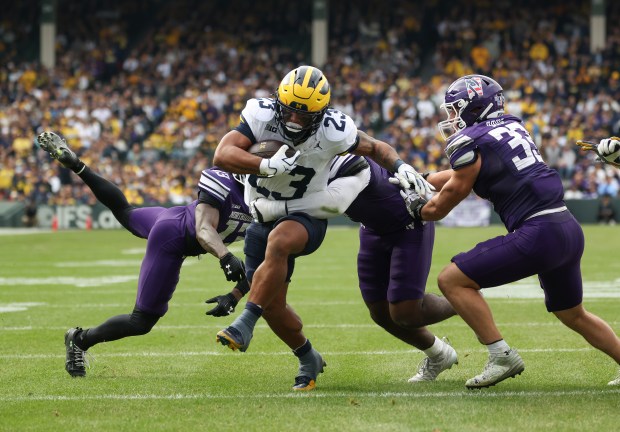 Michigan running back Jordan Marshall (23) rushes in the second quarter against Northwestern at Wrigley Field on Nov. 15, 2025, in Chicago. (John J. Kim/Chicago Tribune)