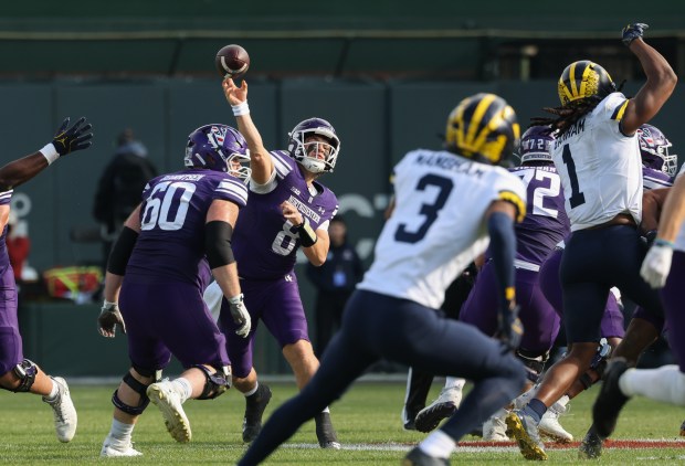 Northwestern quarterback Preston Stone (8) throws in the second quarter against Michigan at Wrigley Field on Nov. 15, 2025, in Chicago. (John J. Kim/Chicago Tribune)
