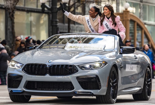 Miss Illinois Nitsaniyah Fitch, left, and Miss Teen Illinois Lillie Brown wave to the crowd during the 91st annual Chicago Thanksgiving Parade on Nov. 27, 2025. (Dominic Di Palermo/Chicago Tribune)