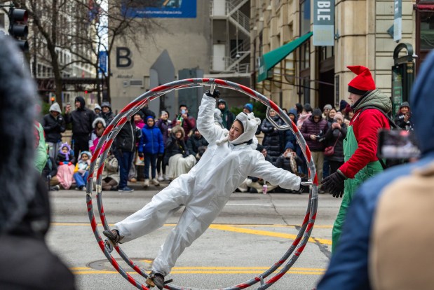 An acrobat performs during the 91st annual Chicago Thanksgiving Parade on Nov. 27, 2025. (Dominic Di Palermo/Chicago Tribune)