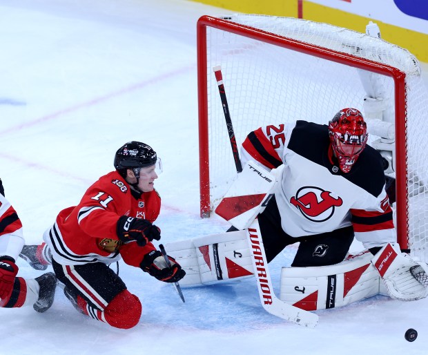 Blackhawks center Oliver Moore is unable to score on Devils goaltender Jacob Markstrom in the second period Wednesday, Nov. 12, 2025, at the United Center. (Chris Sweda/Chicago Tribune)