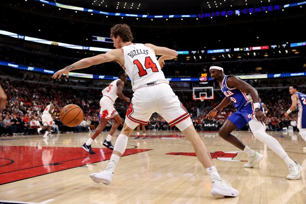 Chicago Bulls forward Matas Buzelis (14) gains control of a loose ball in the second half of a game against the Philadelphia 76ers at the United Center in Chicago on Nov. 4, 2025. (Chris Sweda/Chicago Tribune)
