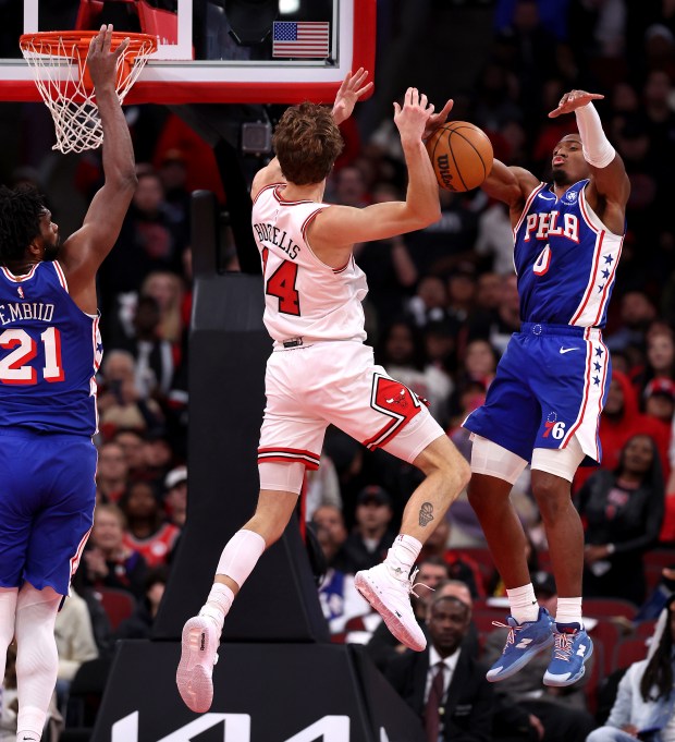 Chicago Bulls forward Matas Buzelis (14) has his layup attempt blocked by Philadelphia 76ers guard Tyrese Maxey (0) late in the second half of a game at the United Center in Chicago on Nov. 4, 2025. (Chris Sweda/Chicago Tribune)