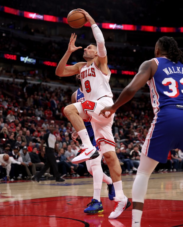 Chicago Bulls center Nikola Vučević (9) drives to the hoop before dunking the ball in the first half of a game against the Philadelphia 76ers at the United Center in Chicago on Nov. 4, 2025. (Chris Sweda/Chicago Tribune)