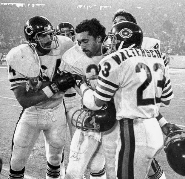 Dave Williams is mobbed by teammates after returning the overtime kickoff 95 yards for a touchdown and the victory over the Detroit Lions at the Pontiac Silverdome in Detroit on Thanksgiving Day, Nov. 27, 1980. (David Nystrom/Chicago Tribune)