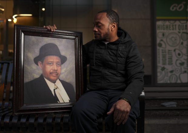 Gary Brown sits on a bench outside his father's former apartment building near the corner of South Michigan Avenue and East 13th Street in the South Loop on Oct. 20, 2025. Brown's father, Gary Ellis, a former CTA bus driver, enjoyed sitting on the bench and watching the activity near the bus stop. (Eileen T. Meslar/Chicago Tribune)