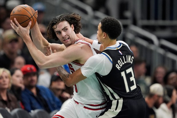 Bulls guard Josh Giddey, left, works against the Bucks' Ryan Rollins in the third quarter of an NBA Cup game at Fiserv Forum on Nov. 7, 2025 in Milwaukee. (Patrick McDermott/Getty Images)
