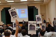 West Dallas neighbors protest the shingle manufacturer GAF at the company's first community...