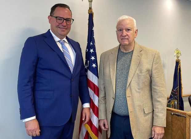 Magisterial District Judge Benjamin Johns, left, with his predecessor Senior District Judge Robert Radano. (PETE BANNAN-DAILY TIMES)