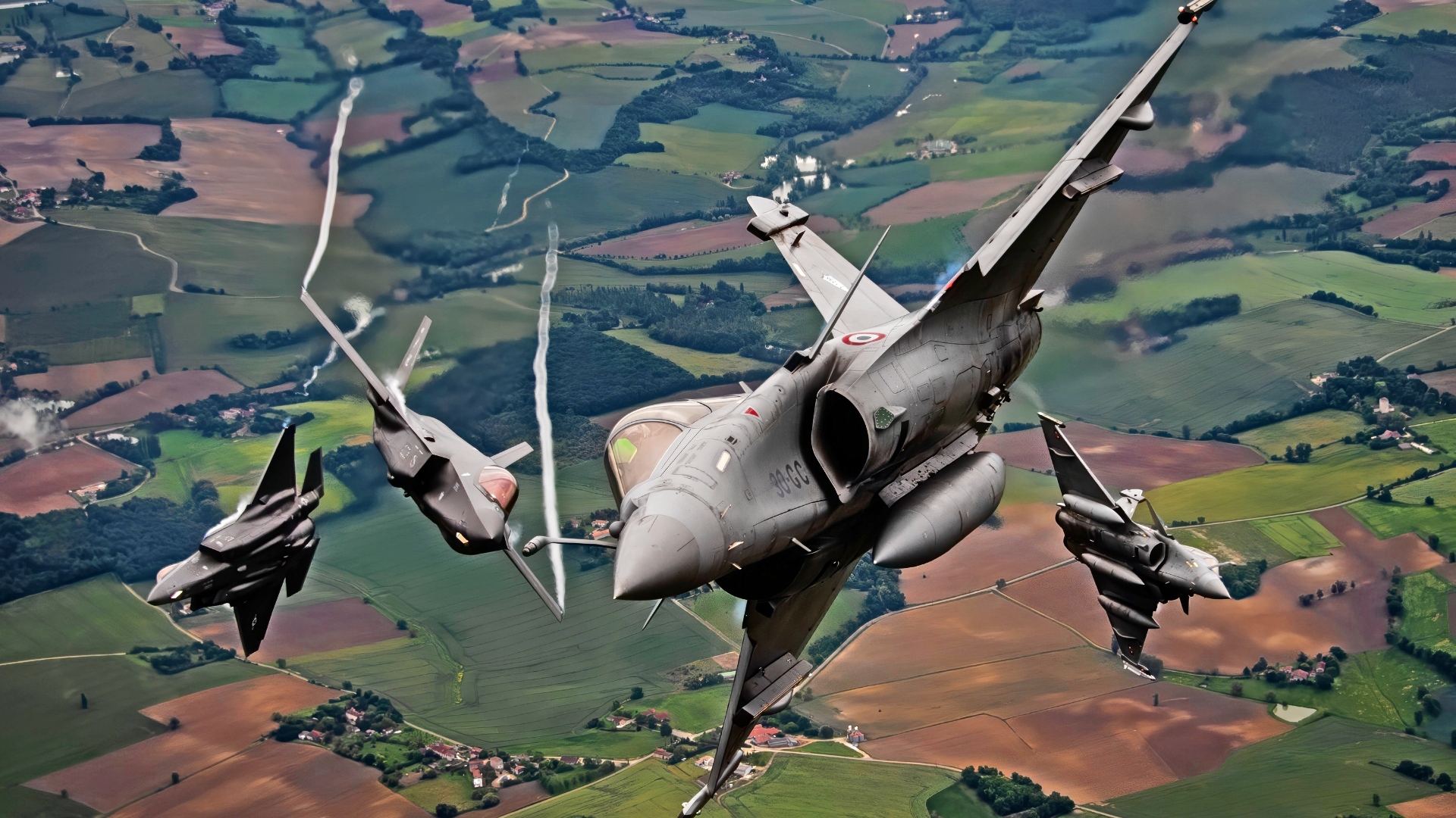 Two U.S. Air Force F-35A Lightning IIs assigned to the 4th Fighter Squadron, Hill Air Force Base, Utah, and two Dassault Rafales assigned to the 1/4 Gascogne Fighter Squadron, 113 Saint-Dizier-Robinson air base, France, break formation during flight May 18, 2021 over France. The flight was apart of the Atlantic Trident 21 exercise which is a joint, multinational exercise involving service members from the U.S., France and the U.K., and is aimed at enhancing fourth and fifth generation integration, combat readiness and fighting capabilities, through conducting complex air operations in a contested multinational joint force environment. (U.S. Air Force photo by Staff Sgt. Alexander Cook)