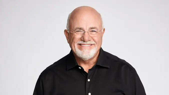 Dave Ramsey smiling confidently on a white background