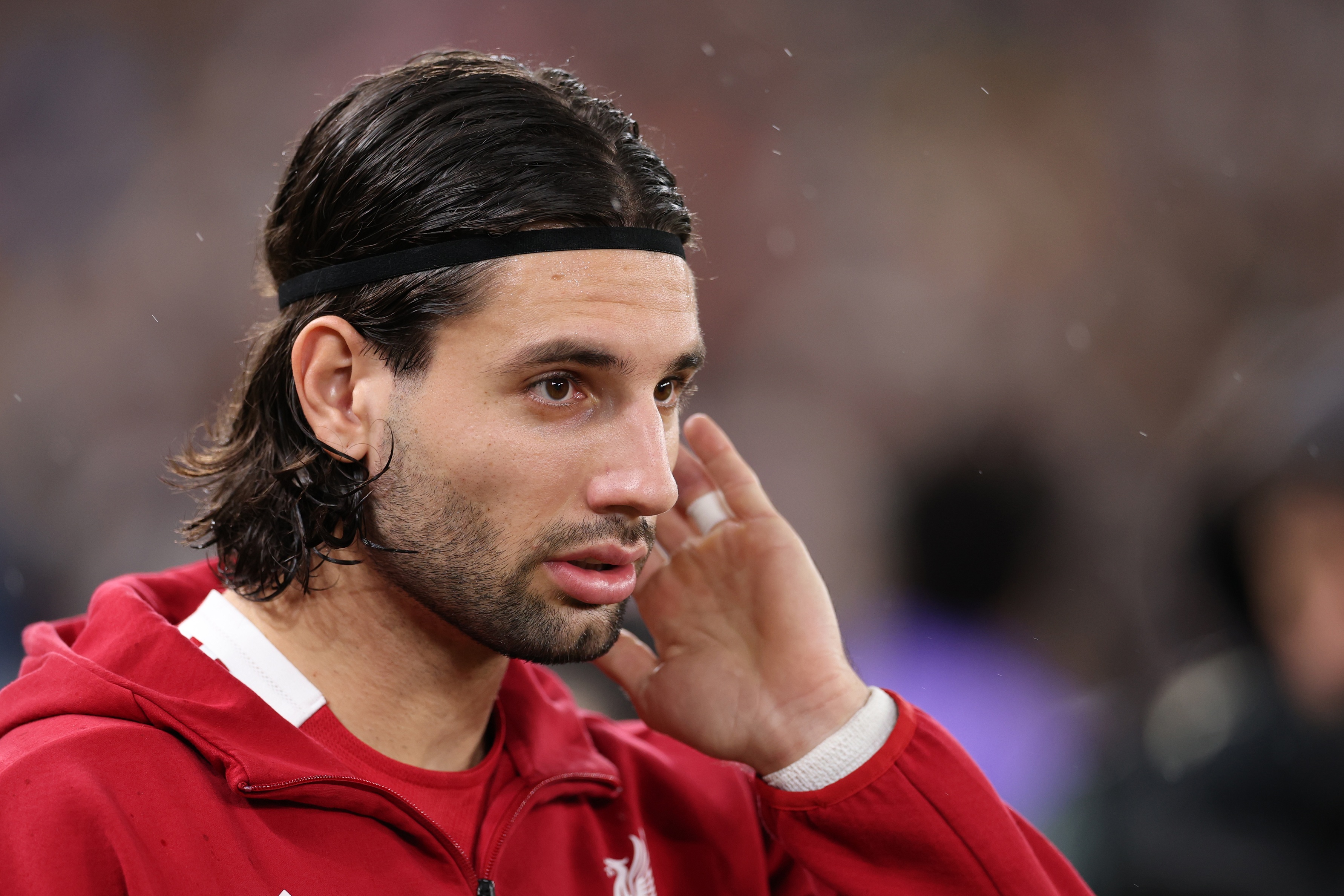 Dominik Szoboszlai touches his head.