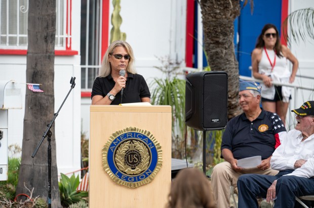 American Legion Auxiliary President Kimberly St. John speaks at the...