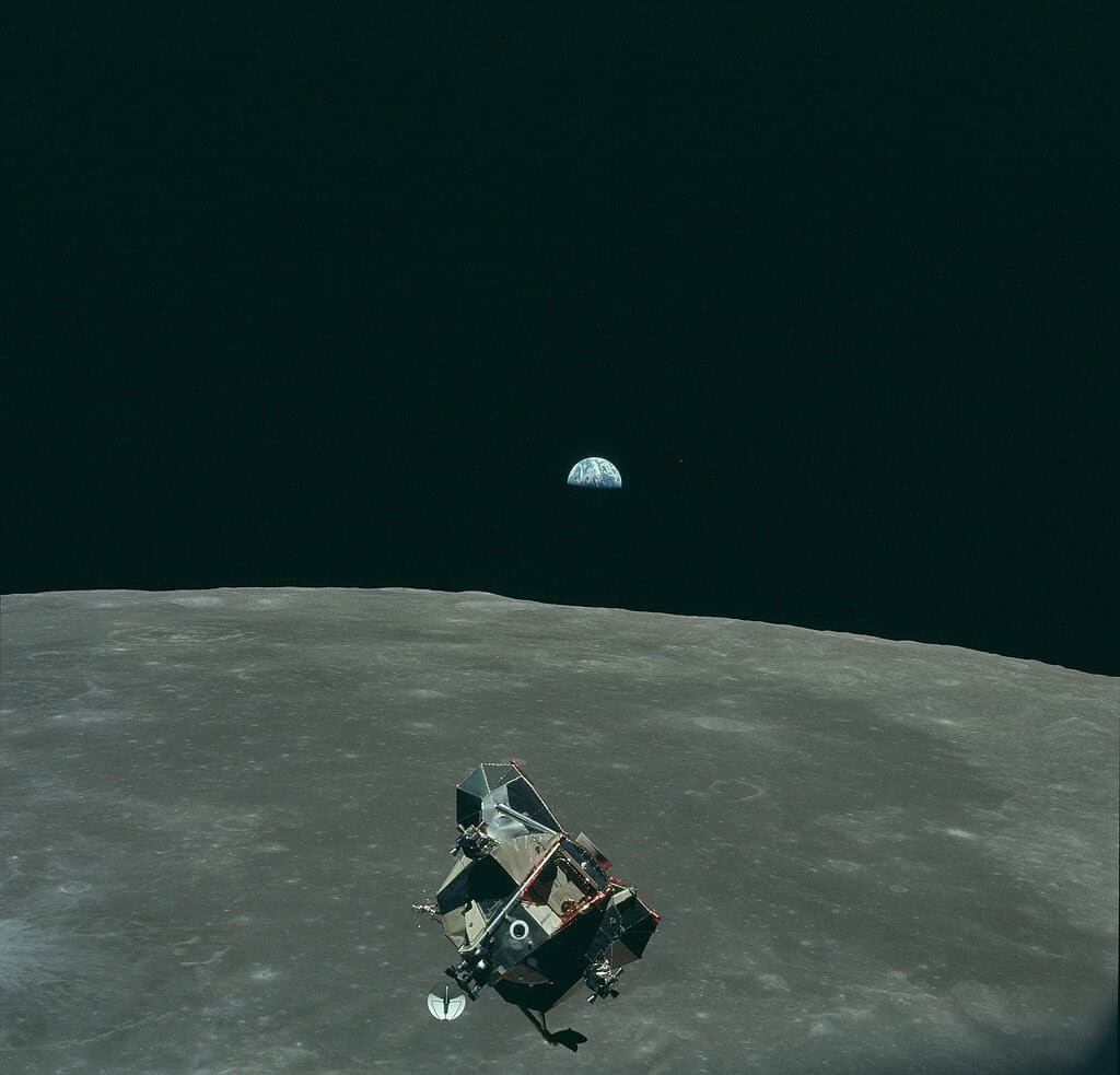 Earth, Moon, and Lunar Module Eagle in lunar orbit after return from the Moon