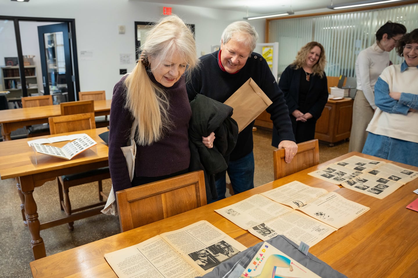 Talking Heads members Tina Weymouth, left, and Chris Frantz look at materials at the Rhode Island School of Design in Providence earlier this year.