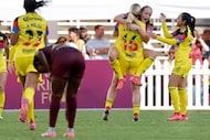 Club América Femenil’s Sarah Luebbert jumps into the arms of her teammate Annie Korick after...