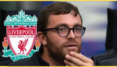 Fabrizio Romano looks on in front of Liverpool club crest.