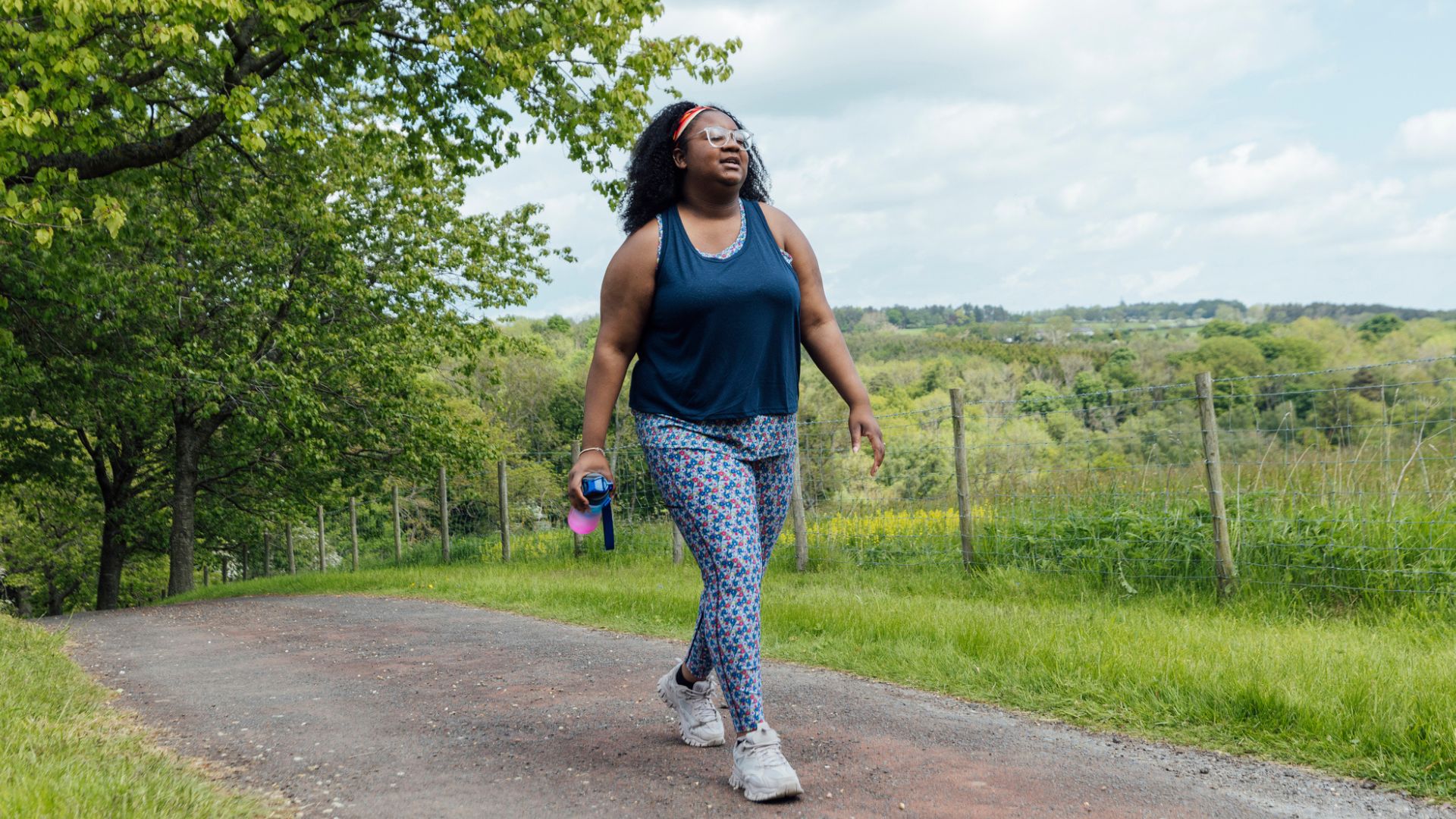 woman in sports kit walking outside