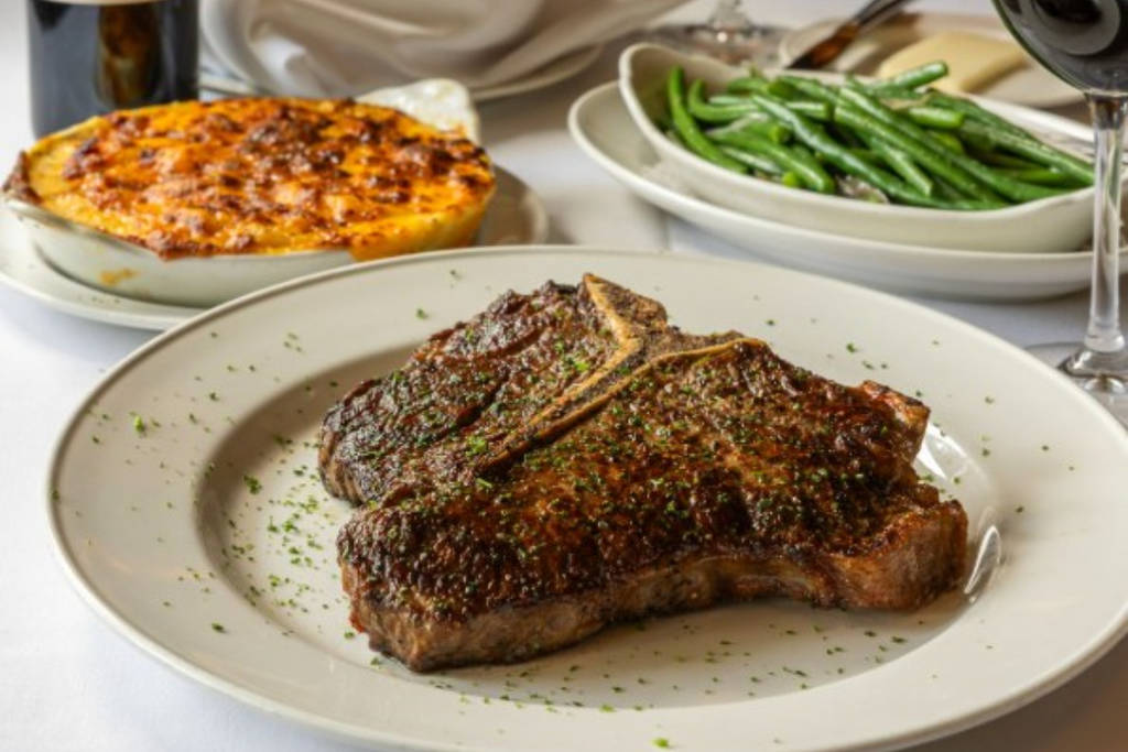 Image shows a steak and sides from Pappas Bros. Steakhouse in Houston.