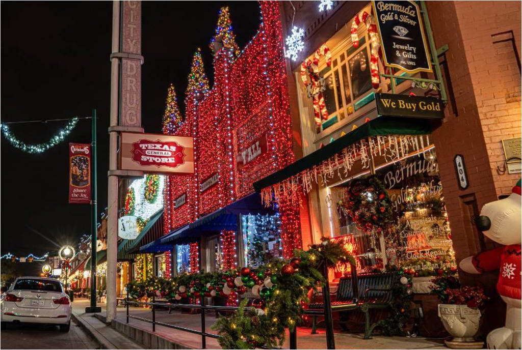 Image shows a storefront adorned in Christmas lights in Grapevine, Texas.