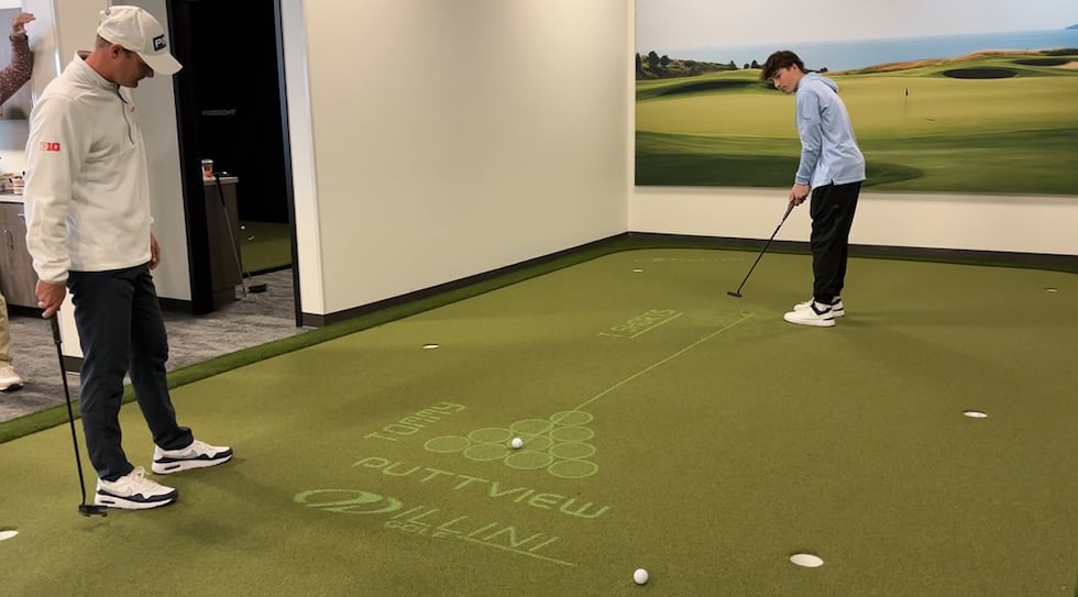 Golfers Tyler Samaan and Tommy Kuhl face off on a "Putt-Off Challenge" at Illini Golf's Small...