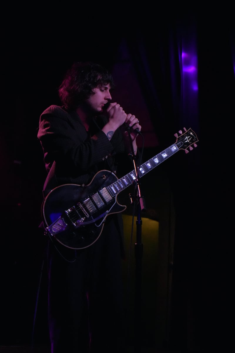DESCRIBE THE IMAGE FOR ACCESSIBILITY, EXAMPLE: Photo of a chef putting red sauce onto an omelette.