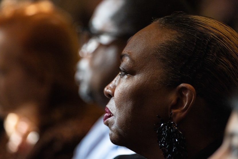 President and CEO of Frazier Revitalization Felisa Conner listens to speakers at a...