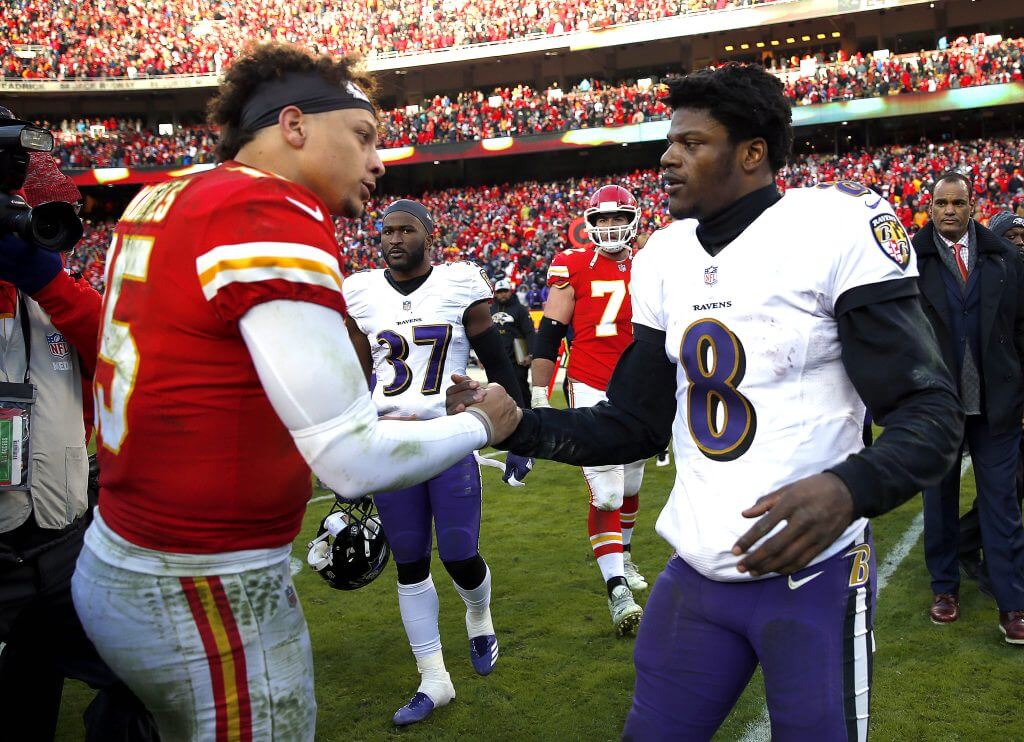 Quarterback Patrick Mahomes #15 of the Kansas City Chiefs shakes hands with quarterback Lamar Jackson #8 of the Baltimore Ravens after the Chiefs defeated the Ravens 27-24 in overtime to win the game at Arrowhead Stadium on December 09, 2018 