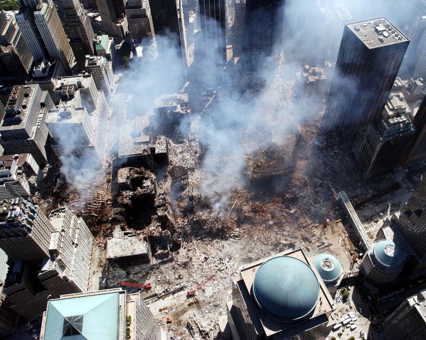 An aerial view shows only a small portion of the crime scene September 16, 2001 where the World Trade Center collapsed following the September 11, 2001 terrorist attack in New York City. Surrounding buildings were heavily damaged by the debris and massive force of the falling twin towers. Clean-up efforts are expected to continue for months. (Photo by Eric J. TIlford/U.S. Navy/Getty Images)