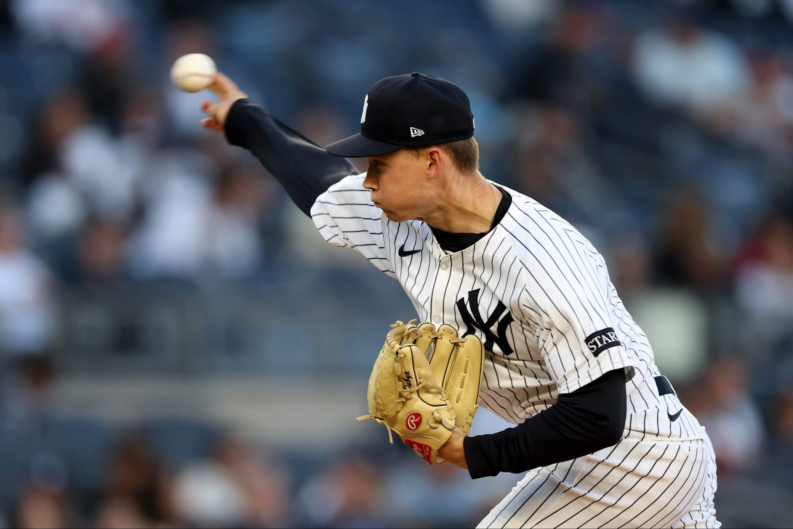 Will Warren #98 of the New York Yankees pitches against the Texas Rangers during the first inning at Yankee Stadium. (Photo by Al Bello/Getty Images)