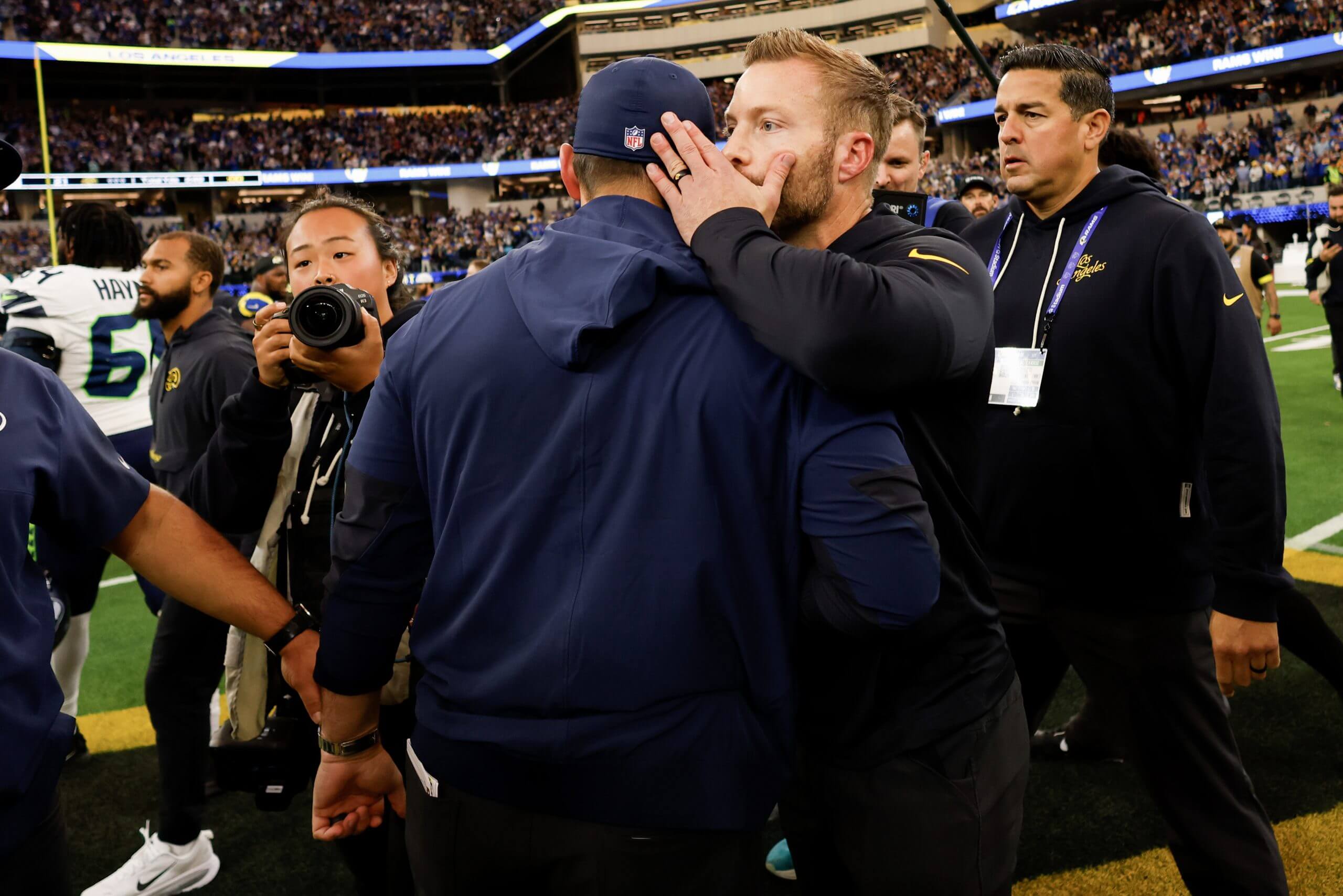 Mike Macdonald and Sean McVay embrace after a Seahawks-Rams game.