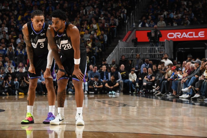 Utah Jazz guards Keyonte George (left) and Brice Sensabaugh (right) talk during the game against the Golden State Warriors on Nov. 24 at Chase Center in San Francisco.