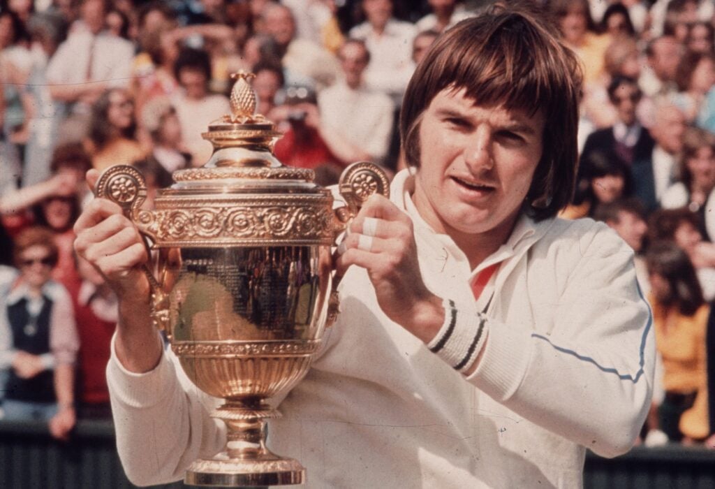 Jimmy Connors celebrates with the Wimbledon title in 1974