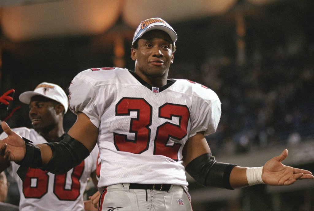 Jamal Anderson #32 of the Atlanta Falcons celebrates after winning the NFC Championship Game against the Minnesota Vikings at the H. H. H. Metrodome in Minneapolis, Minnesota. The Falcons defeated the Vikings 30-27 in overtime. 