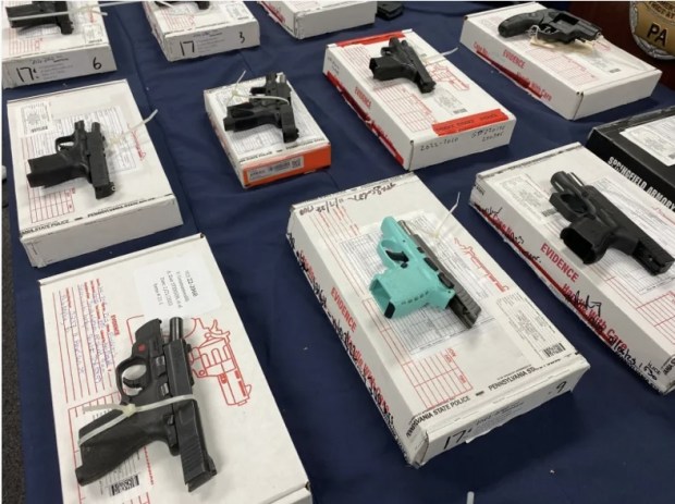 During a Feb. 22, 2023, news conference in Montgomery County, authorities displayed the guns linked to a gun trafficking network. (Photo by Carl Hessler Jr. - MediaNews Group)
