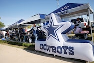 Fans spend time tailgating before an NFL football game between the Dallas Cowboys and the...