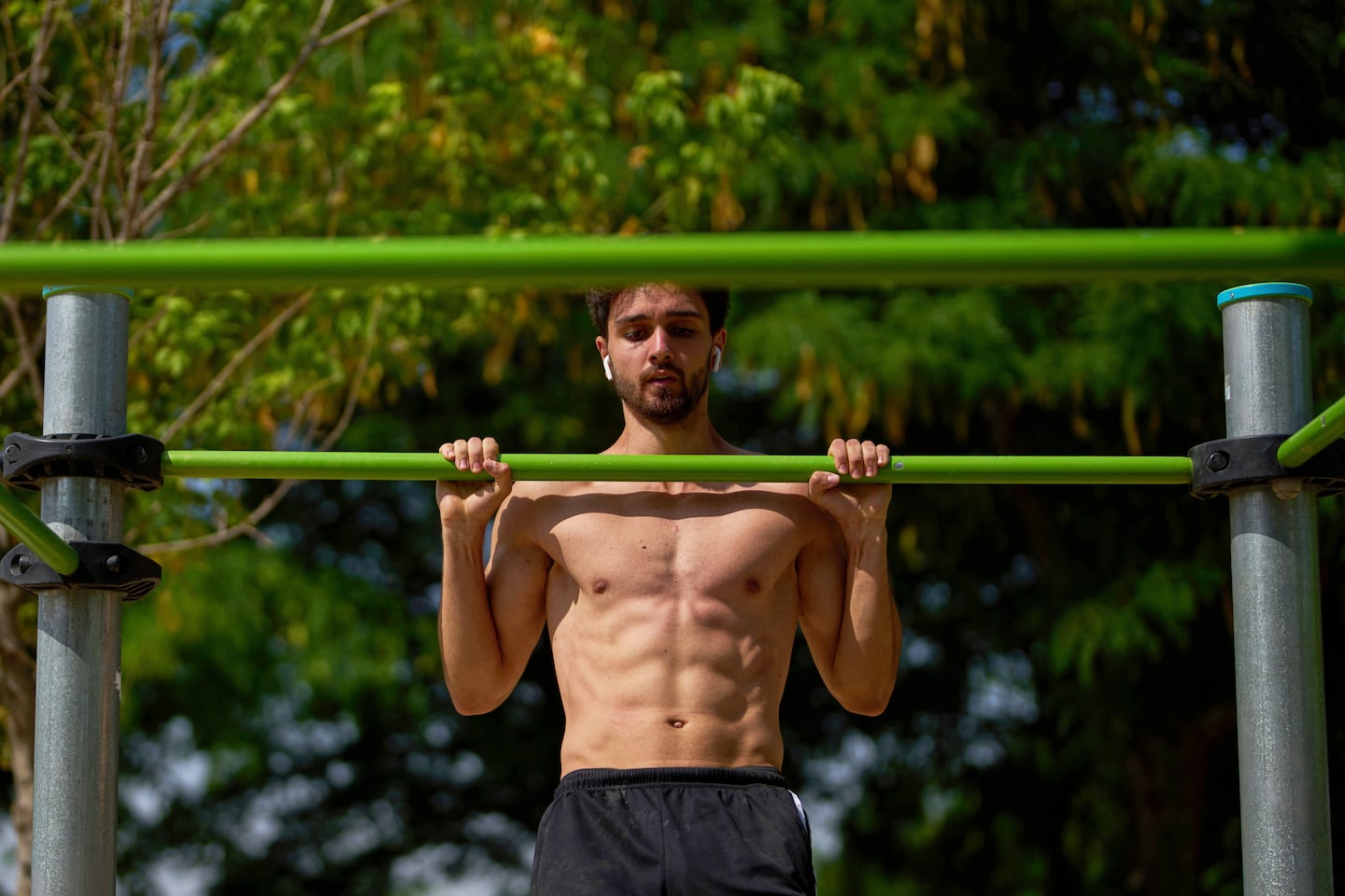 A man works out in a public park in Madrid.