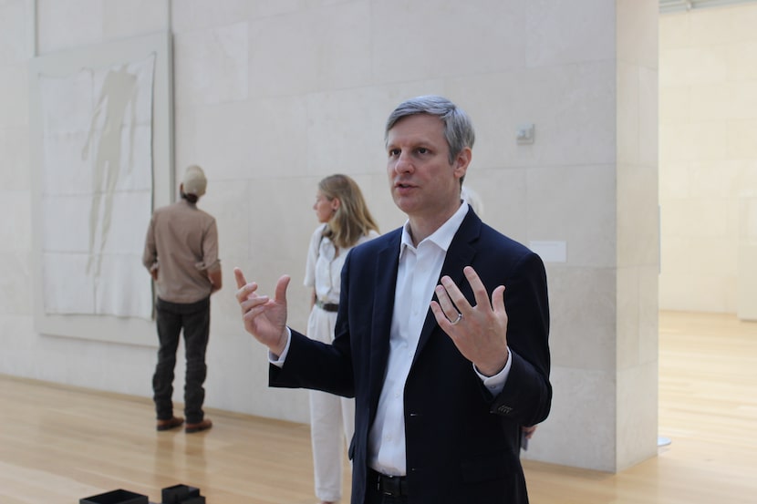 Jed Morse, chief curator at the Nasher Sculpture Center, speaks with guests at a preview for...