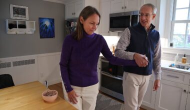 Doug Hano helped his wife, Kirsten, in the kitchen of their home. Doug has struggled to find home care for Kirsten, who was diagnosed at age 53 with early onset Alzheimer's.