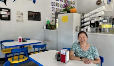 Blue Fin owner Lyn Yee sits inside her restaurant.