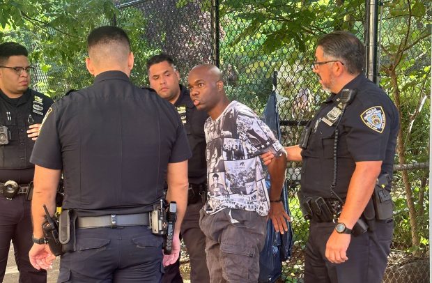 Jimmy Avila is taken into custody on College Ave. in the Bronx after the triple shooting on Wednesday.