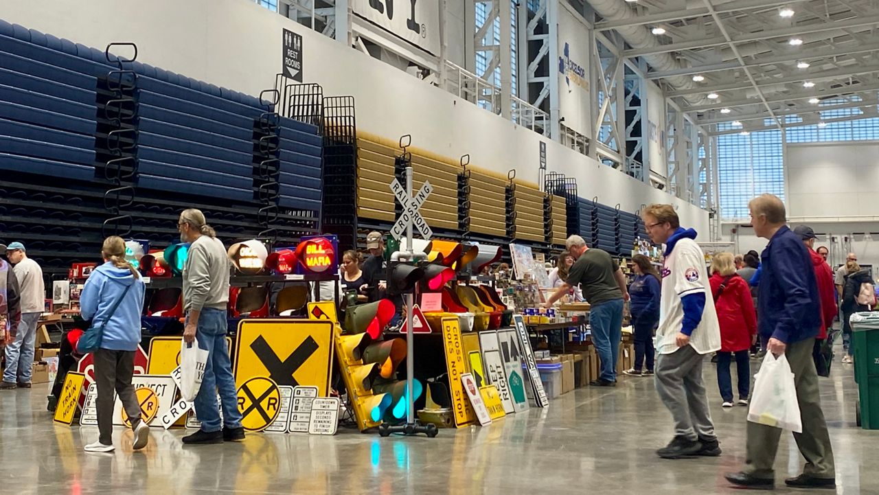 people walk around the great new york state model train fair