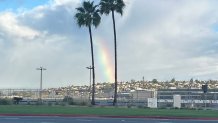 A rainbow was captured over the the runway at San Diego International Airport, Sunday, November 16, 2025.