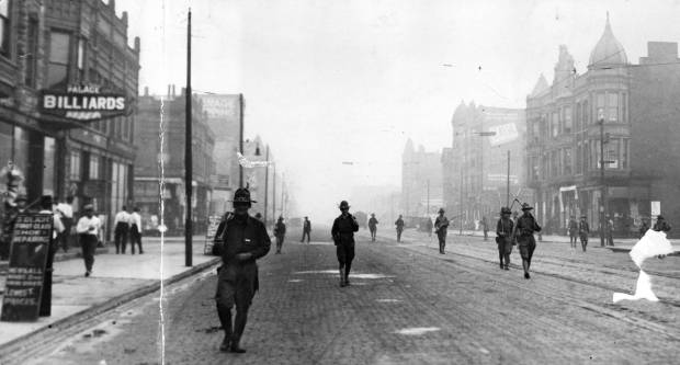 Members of the state-run militia patrol the streets of Chicago...