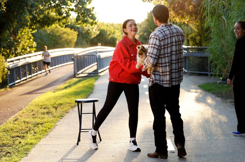 Datey founder Abbey Hagan having her photo taken on the Katy Trail, as Morgan Finch stopped...