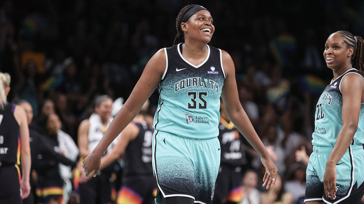 Aug 13, 2025; Las Vegas, Nevada, USA; Las Vegas Aces center A'ja Wilson (22) shoots against New York Liberty forward Kennedy Burke (22) and guard Natasha Cloud (9) during the second quarter of their game at Michelob Ultra Arena. Mandatory Credit: Candice Ward-Imagn Images