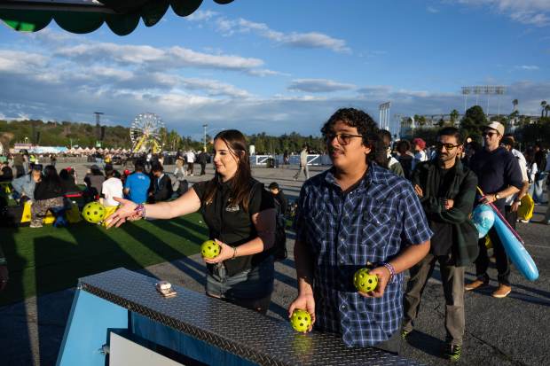 Festivalgoers enjoy carnival games during Day one of the Camp Flog Gnaw...