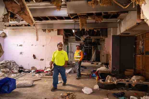 Sean Lynch and Luis Garcia, of Heritage 1976, look over...