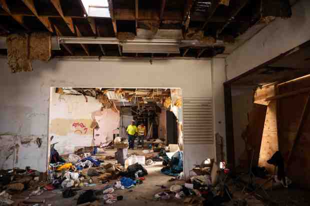 Sean Lynch and Luis Garcia, of Heritage 1976, look over...